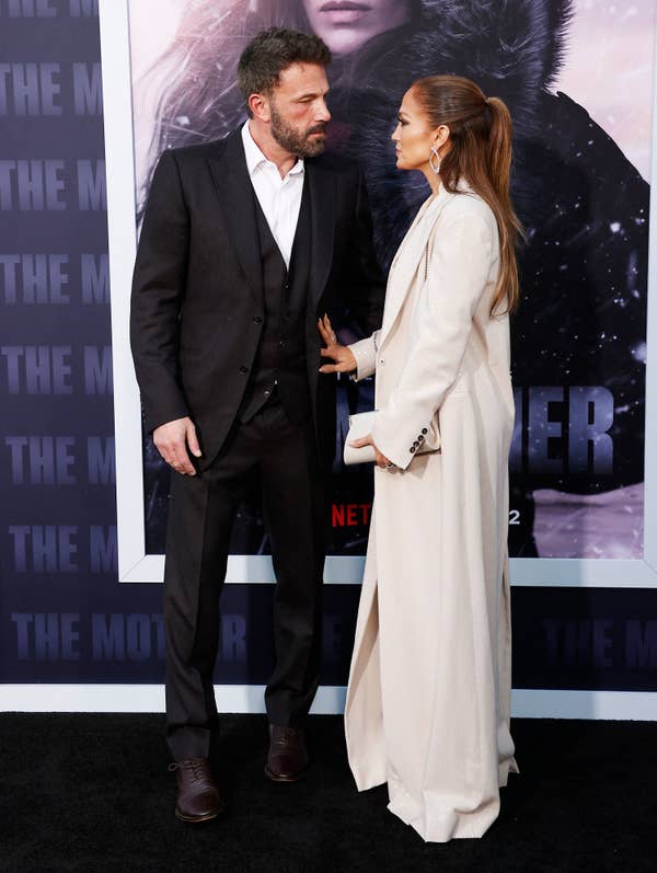Ben and JLo looking at each other tensely