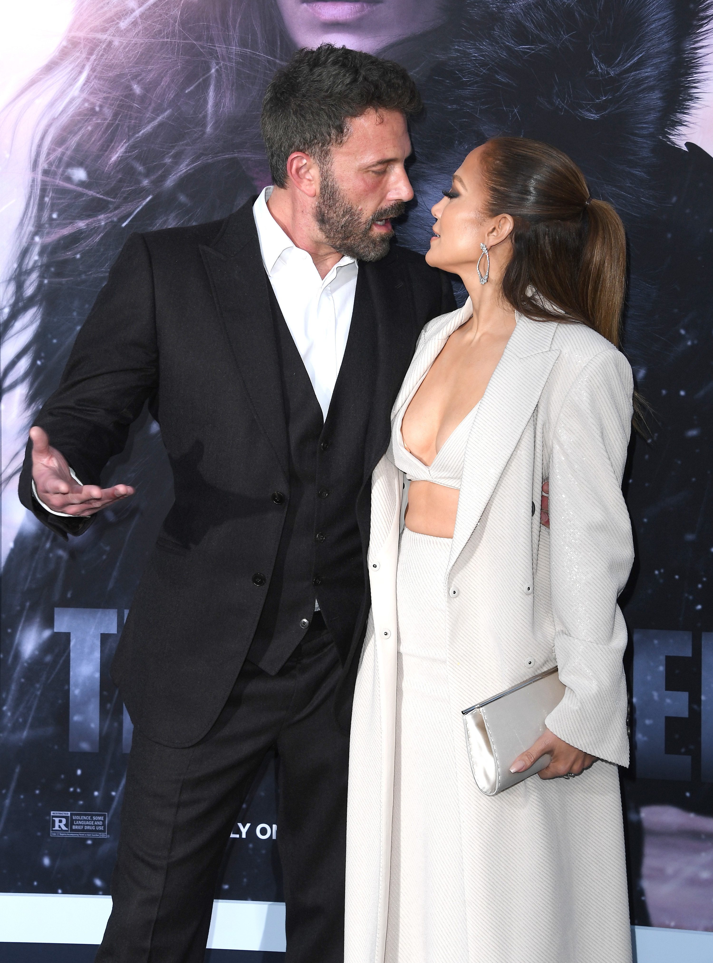Ben and JLo looking at each other tensely