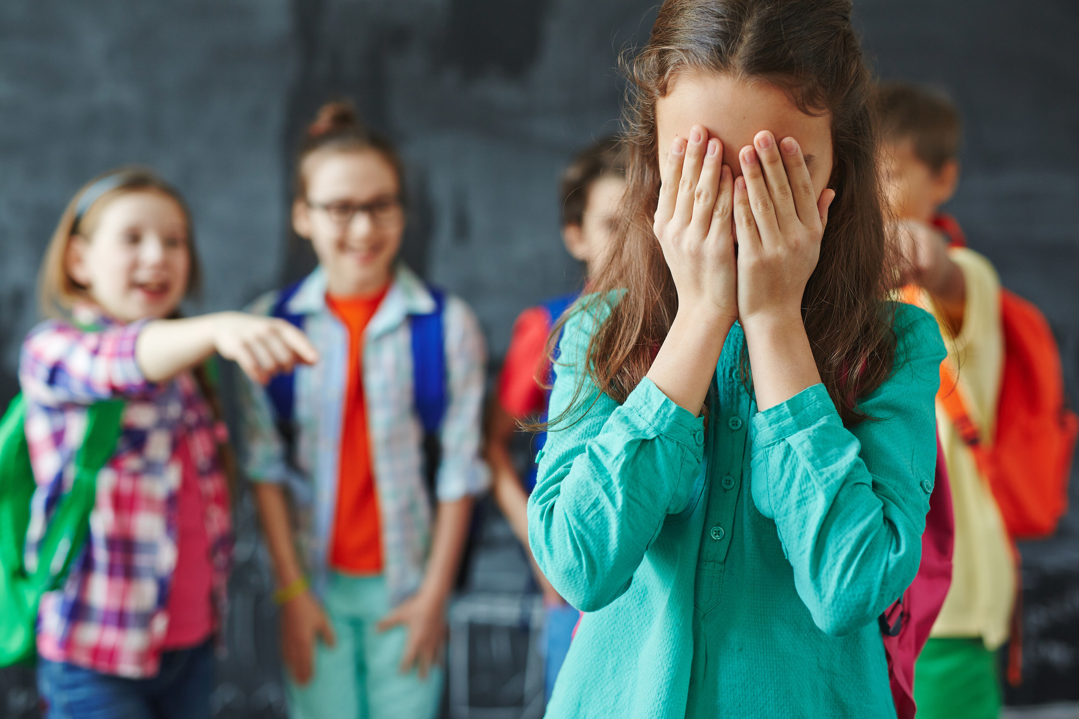 Kids bullying a girl in school