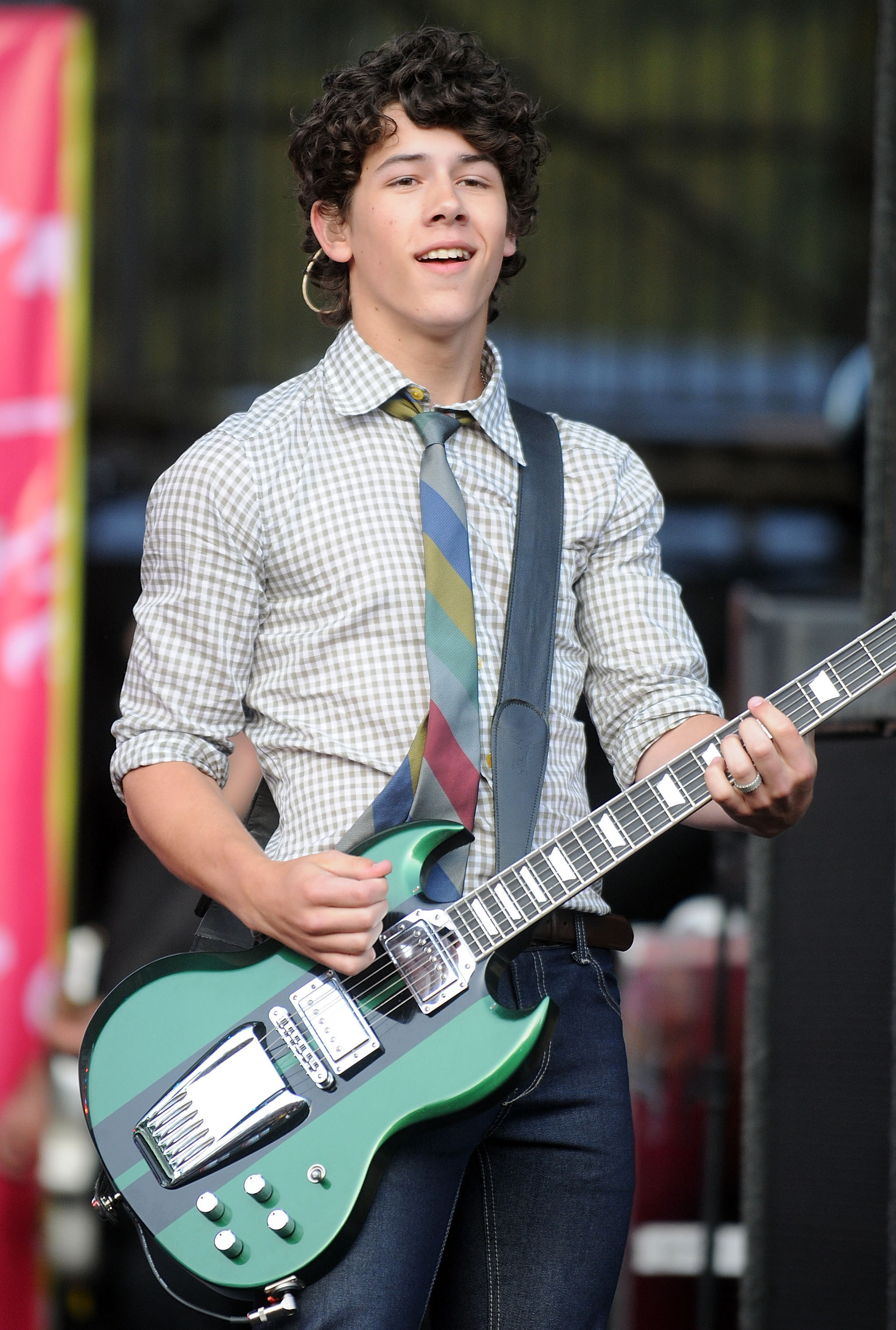 nick playing guitar on stage