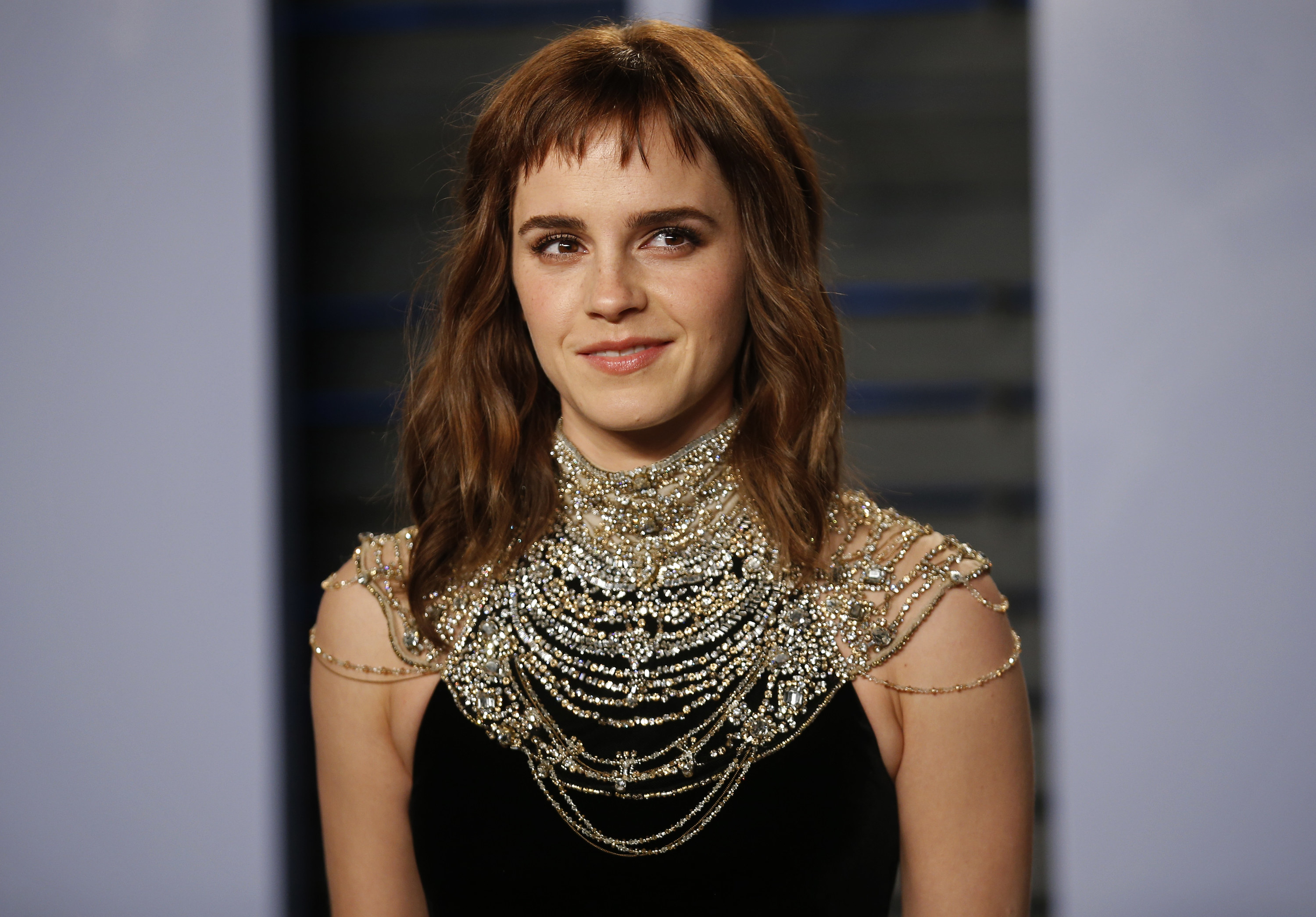 Close-up of Emma in an elaborate necklace and halter top