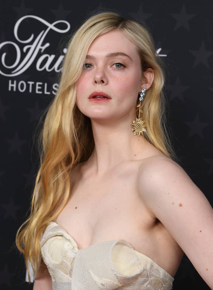 Close-up of Elle in a strapless outfit