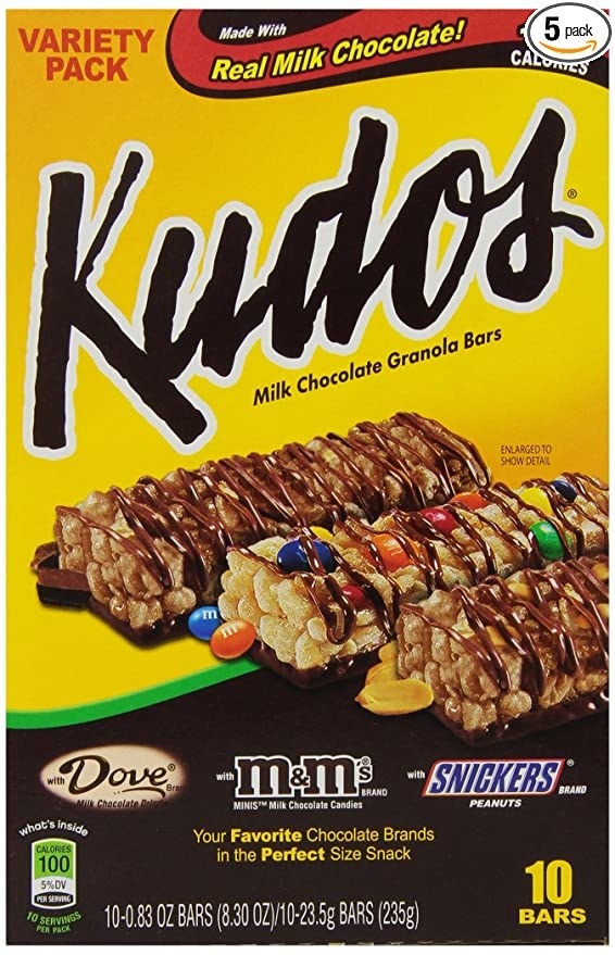 A front display of a box of Kudos in three flavors: Dove chocolate, M&amp;amp;M, and Snickers