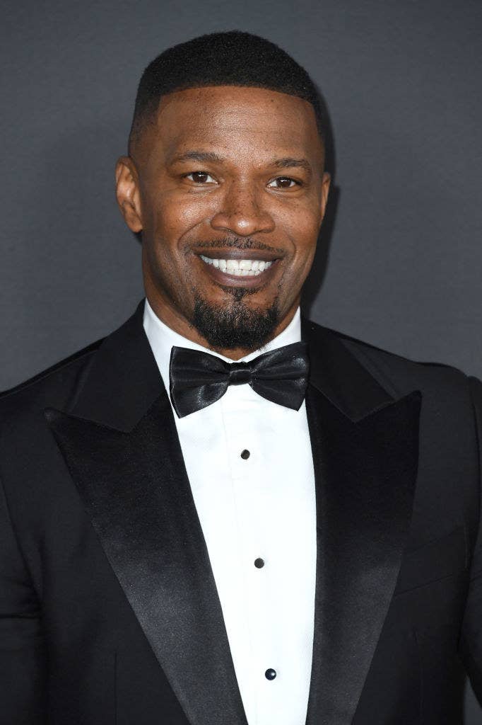 Jamie Foxx smiling. He&#x27;s wearing a suit and bowtie