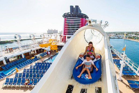 a mom and son riding the Aquaduck water slide