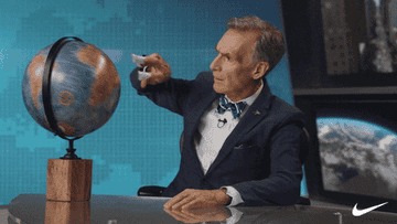 Bill Nye spinning a globe