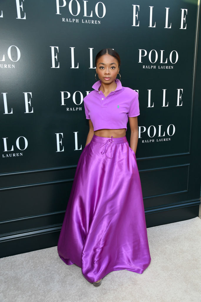 in a long gown skirt and cropped top polo