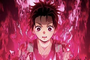 boy from "demon slayer" anime tv show in fire