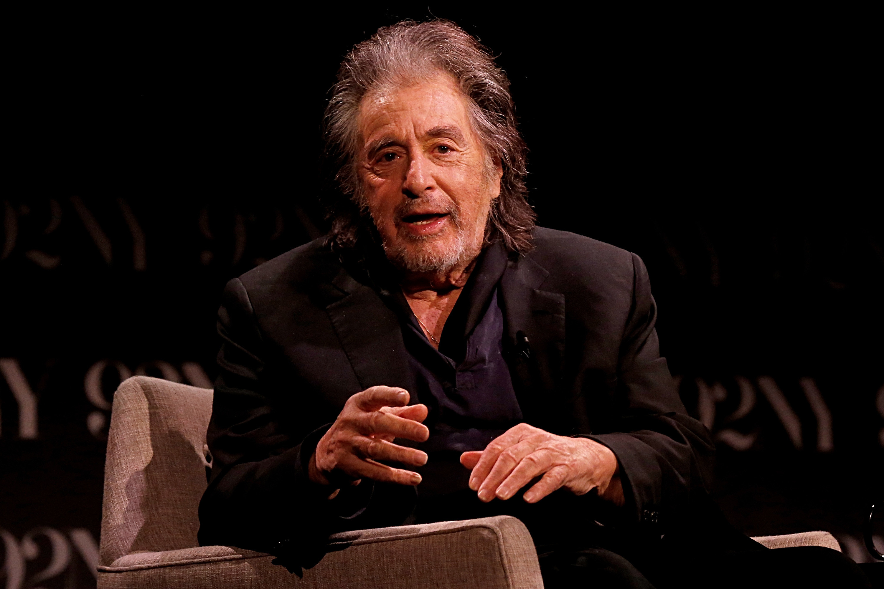 al pacino speaking on a stage