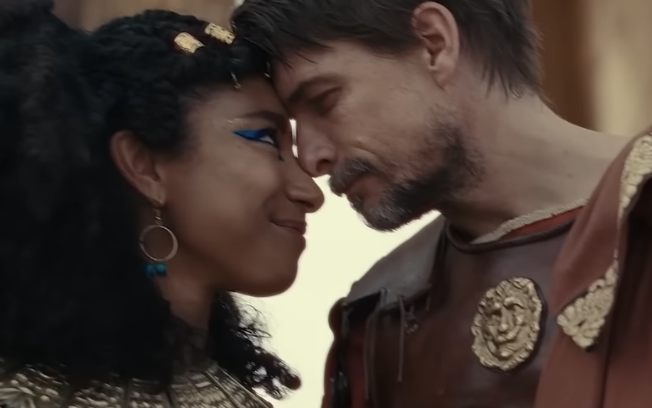 cleopatra and a man with their foreheads touching