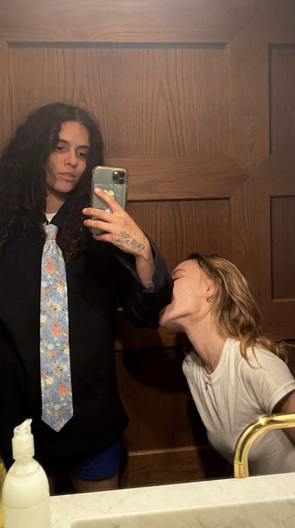 lily biting 070 shake&#x27;s arm while they take a mirror selfie