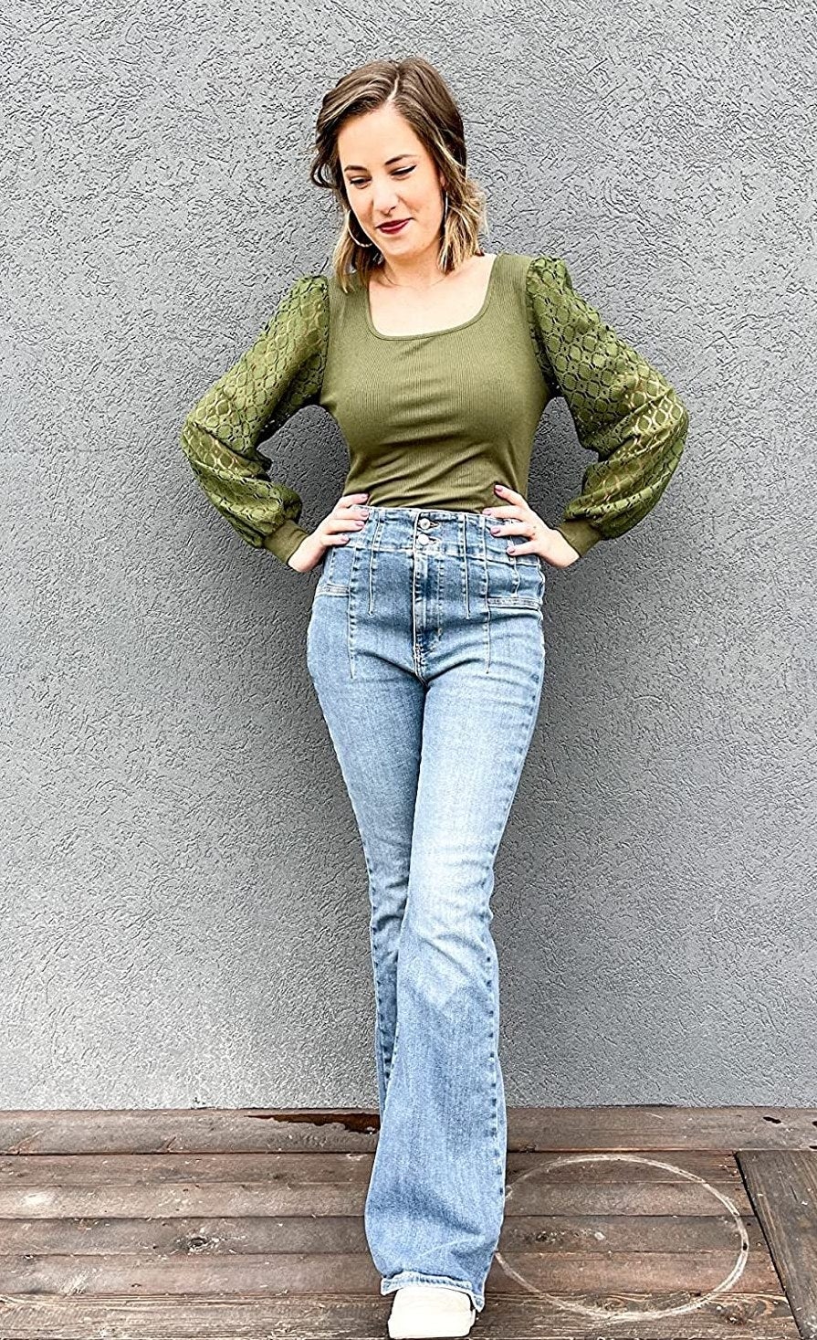 Reviewer wearing the greenish  top