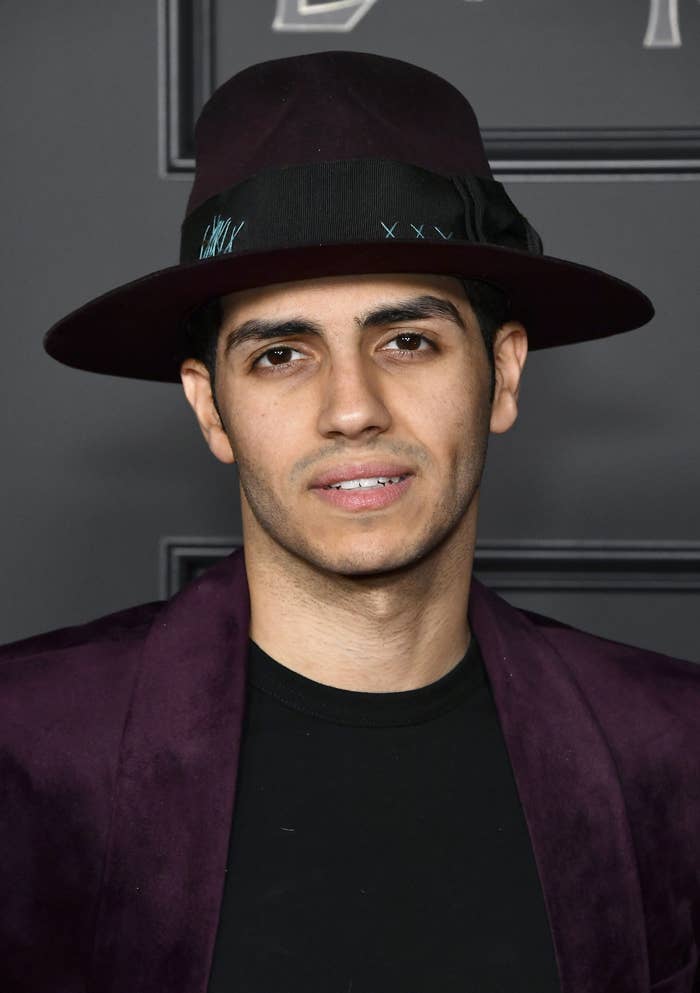 Close-up of Mena in a brimmed hat