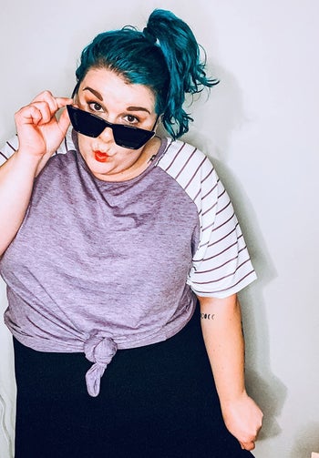 Reviewer wearing the light purple top