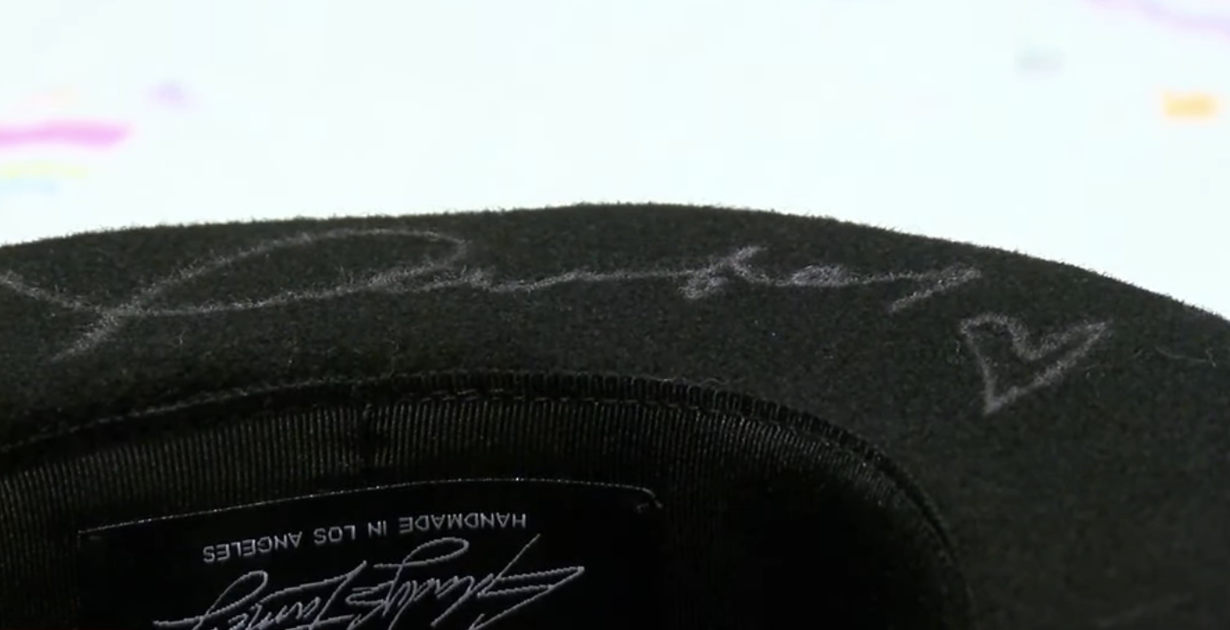 Closeup of a hat signed by Taylor Swift