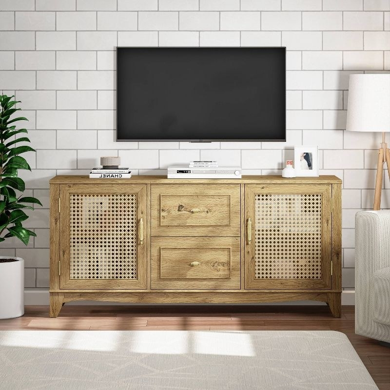 a yellow, wooden TV with two drawers and two doors