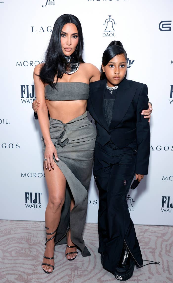 Kim and North with their arms around each other