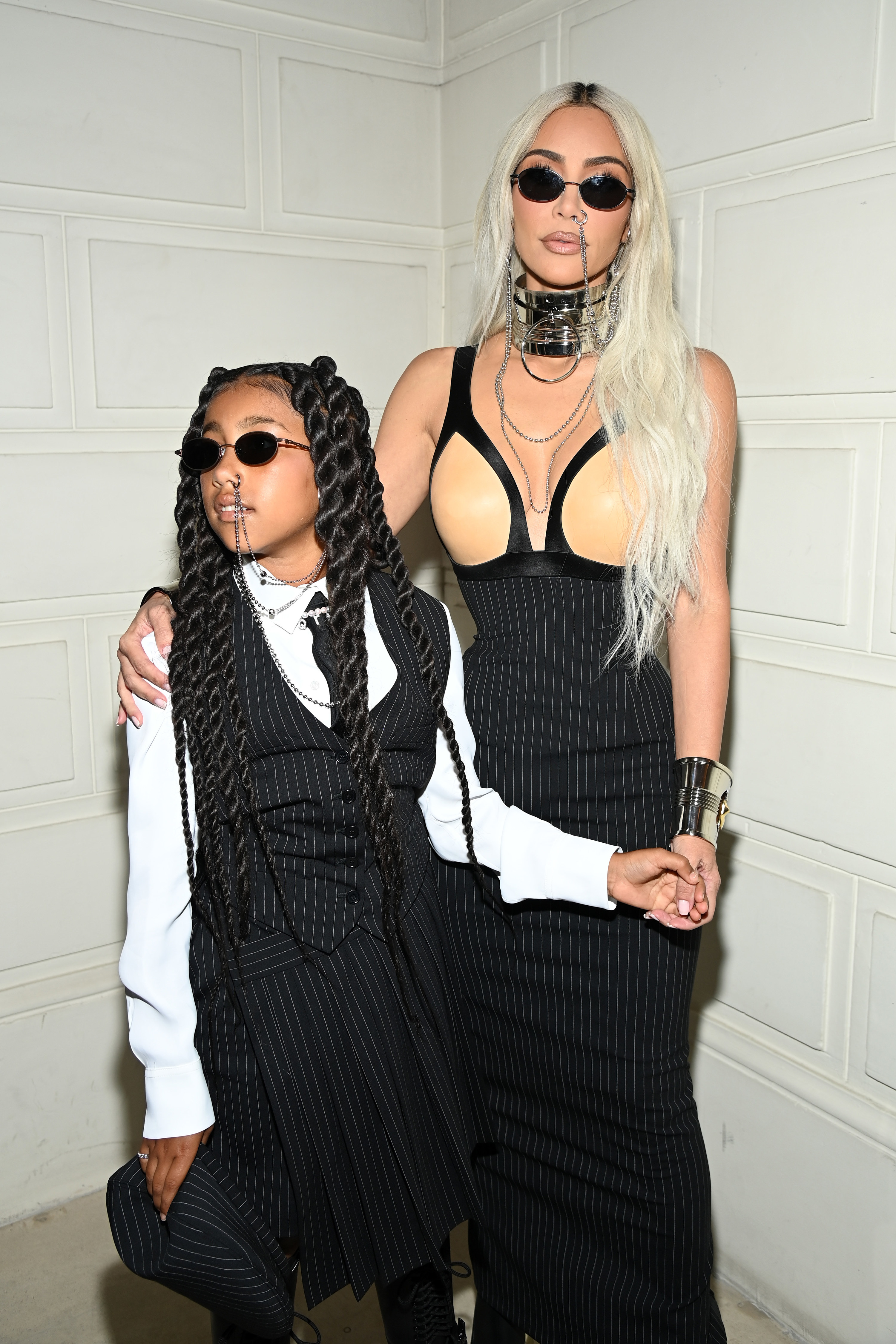 North and Kim in pin-striped outfits