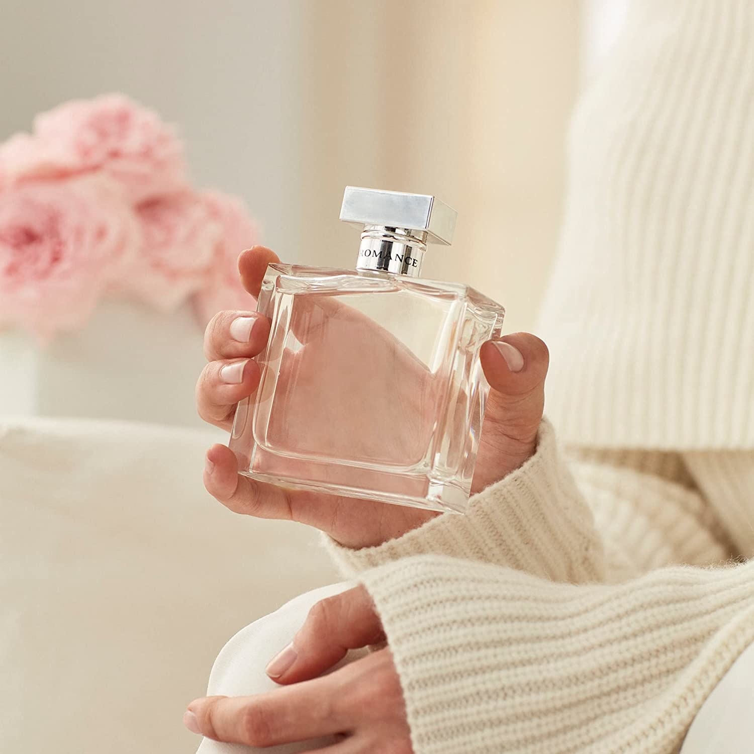 A model holding perfume