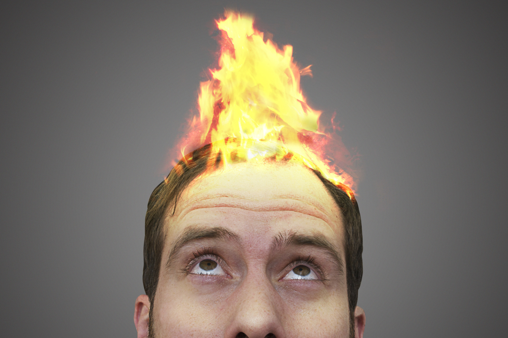 A man&#x27;s head on fire