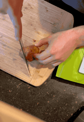 person cutting upon the potato revealing the inside to be really dried out