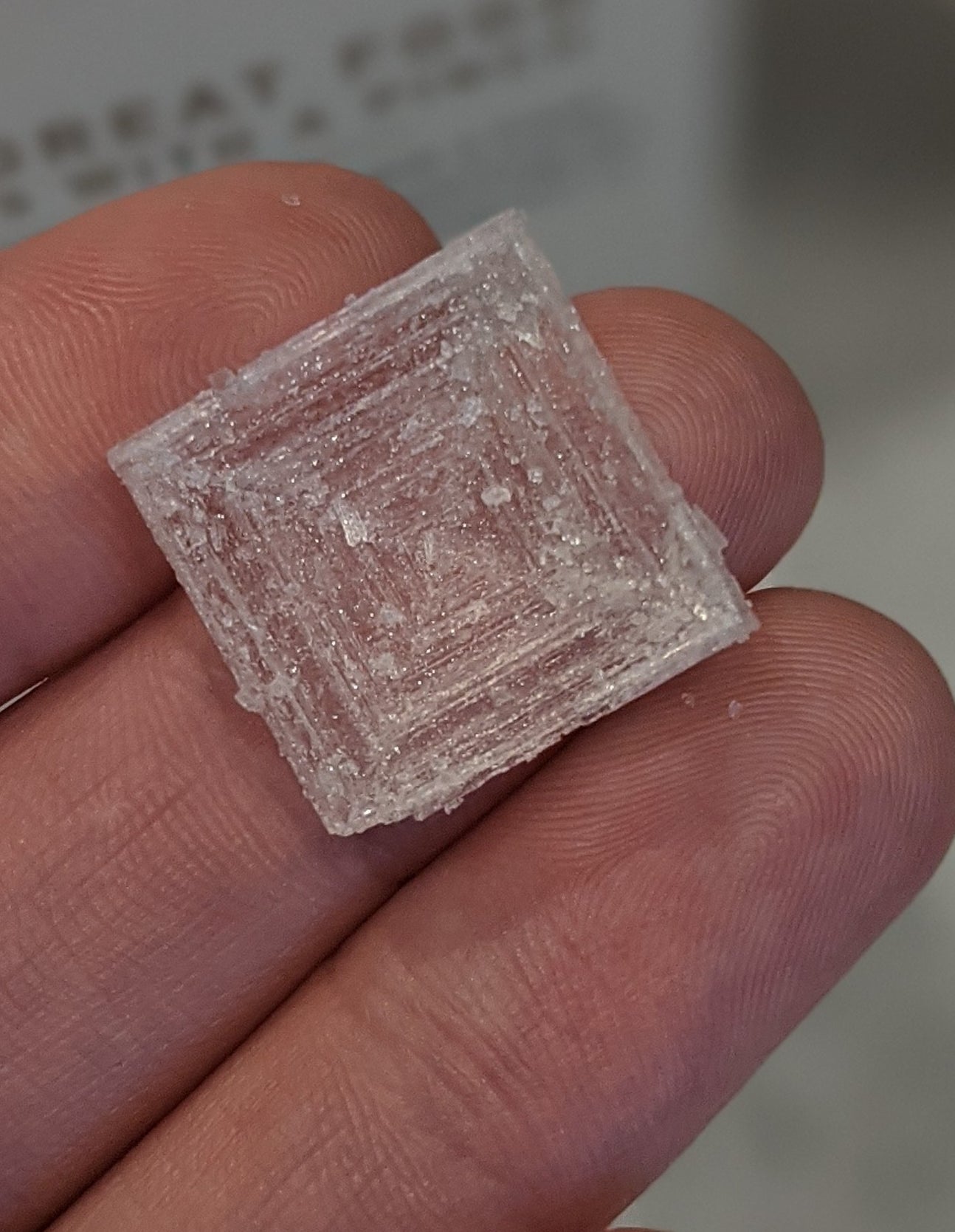 a salt crystal that's very square and the size of a human finger tip