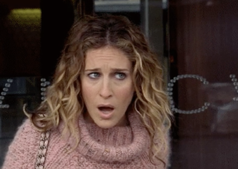 Closeup of Carrie Bradshaw looking shocked