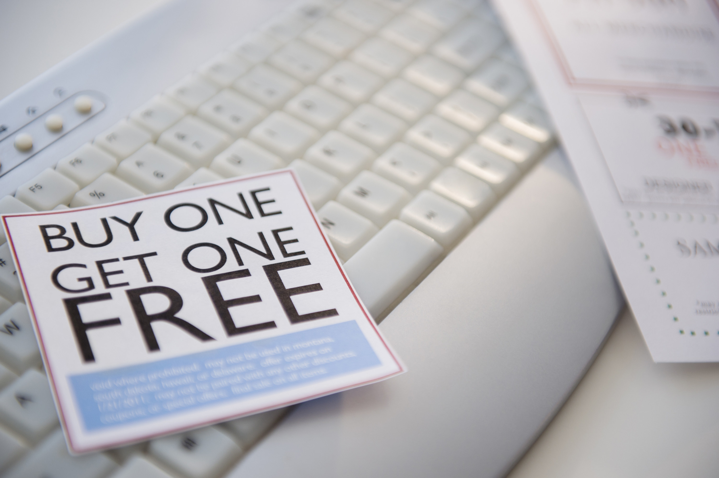 &quot;Buy one get one free&quot; coupon on a computer keyboard