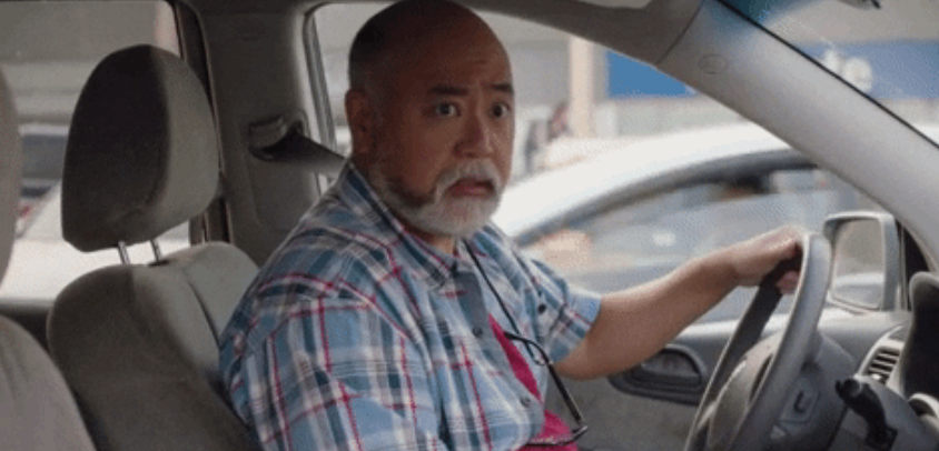 A man driving a car