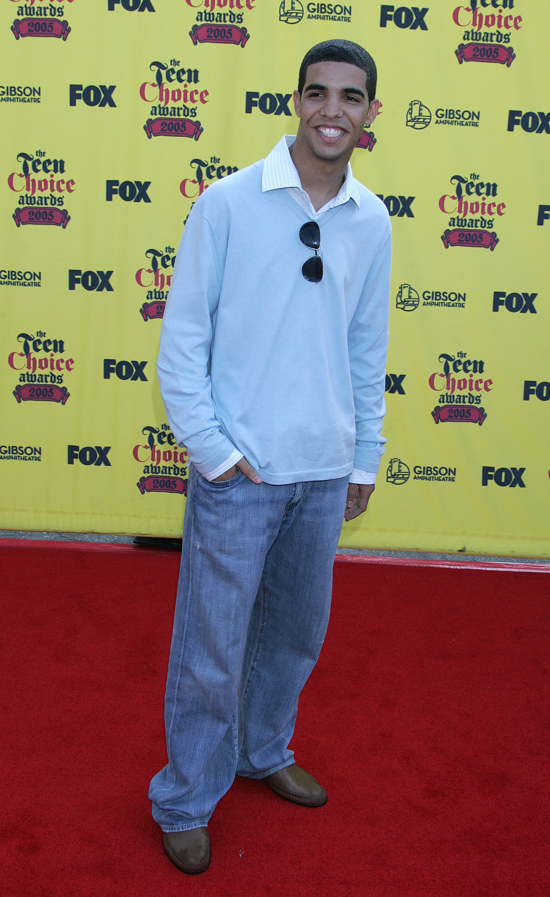 on the red carpet in jeans and polo shirt