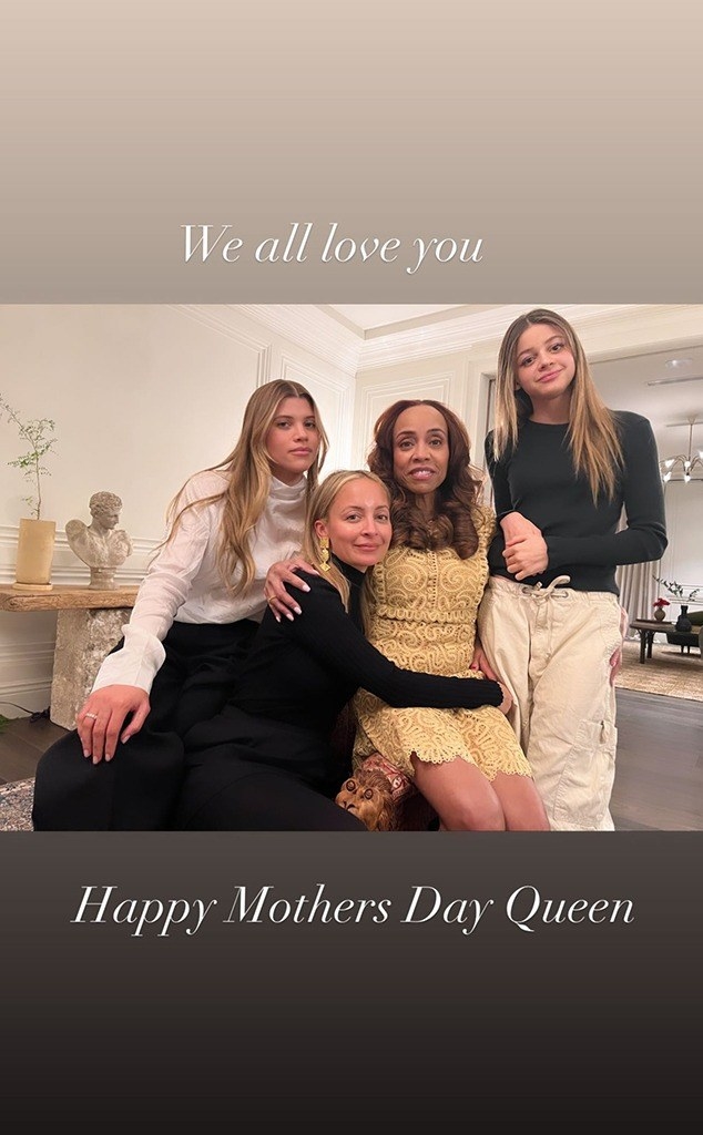 Nicole, Harlow, Sofia and Brenda all embrace while sitting on a chair together