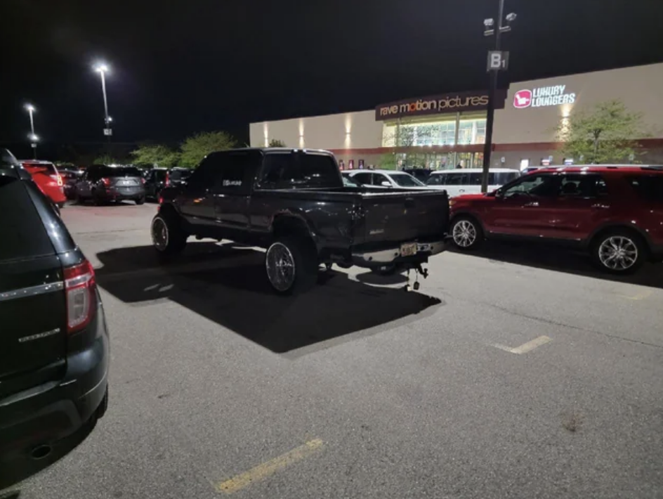 truck parked in the middle of four spots