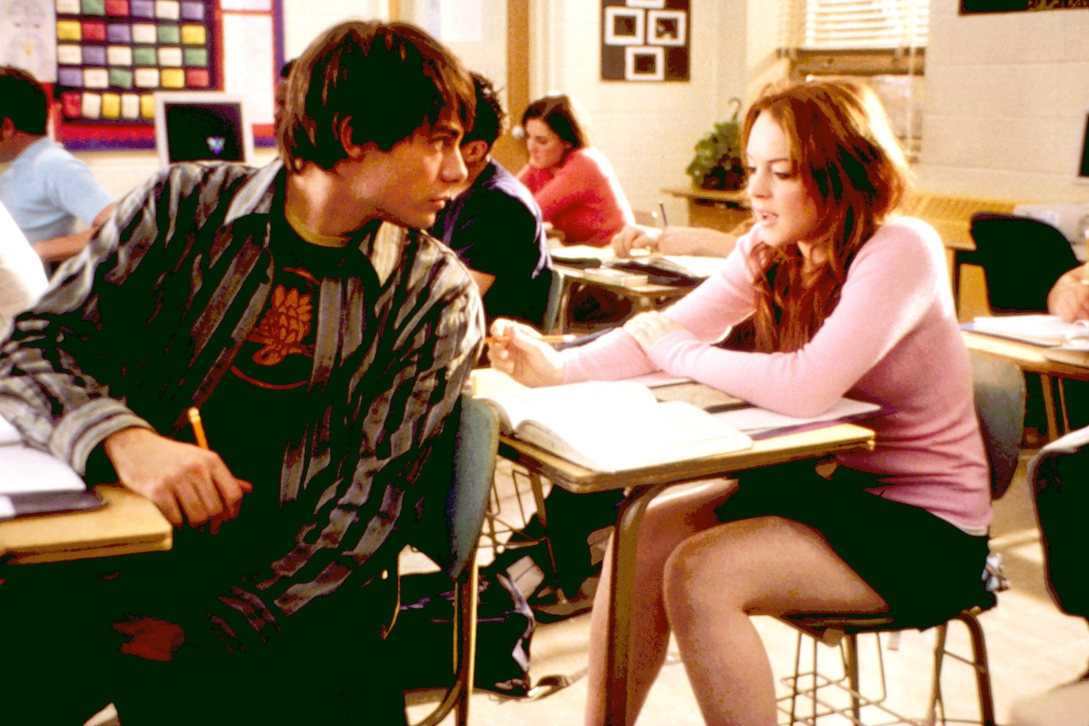 Jonathan looking back at Lindsay Lohan as they sit in a classroom in a scene from the film