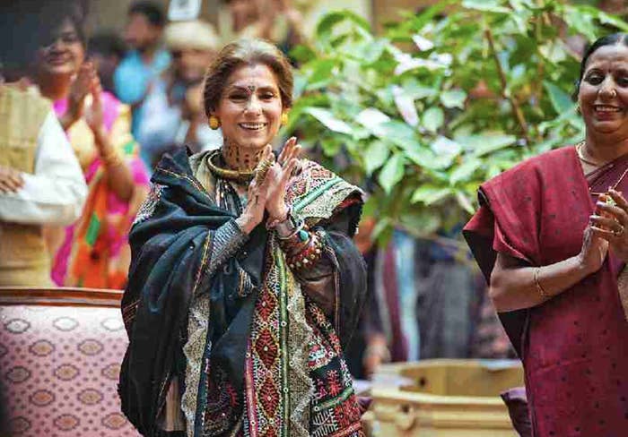 dimple kapadia folds her hands and smiles