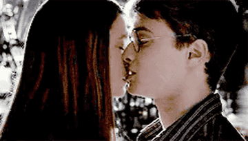 Bonnie Wright and Daniel Radcliffe do something that approximates a human kiss in the Harry Potter franichse