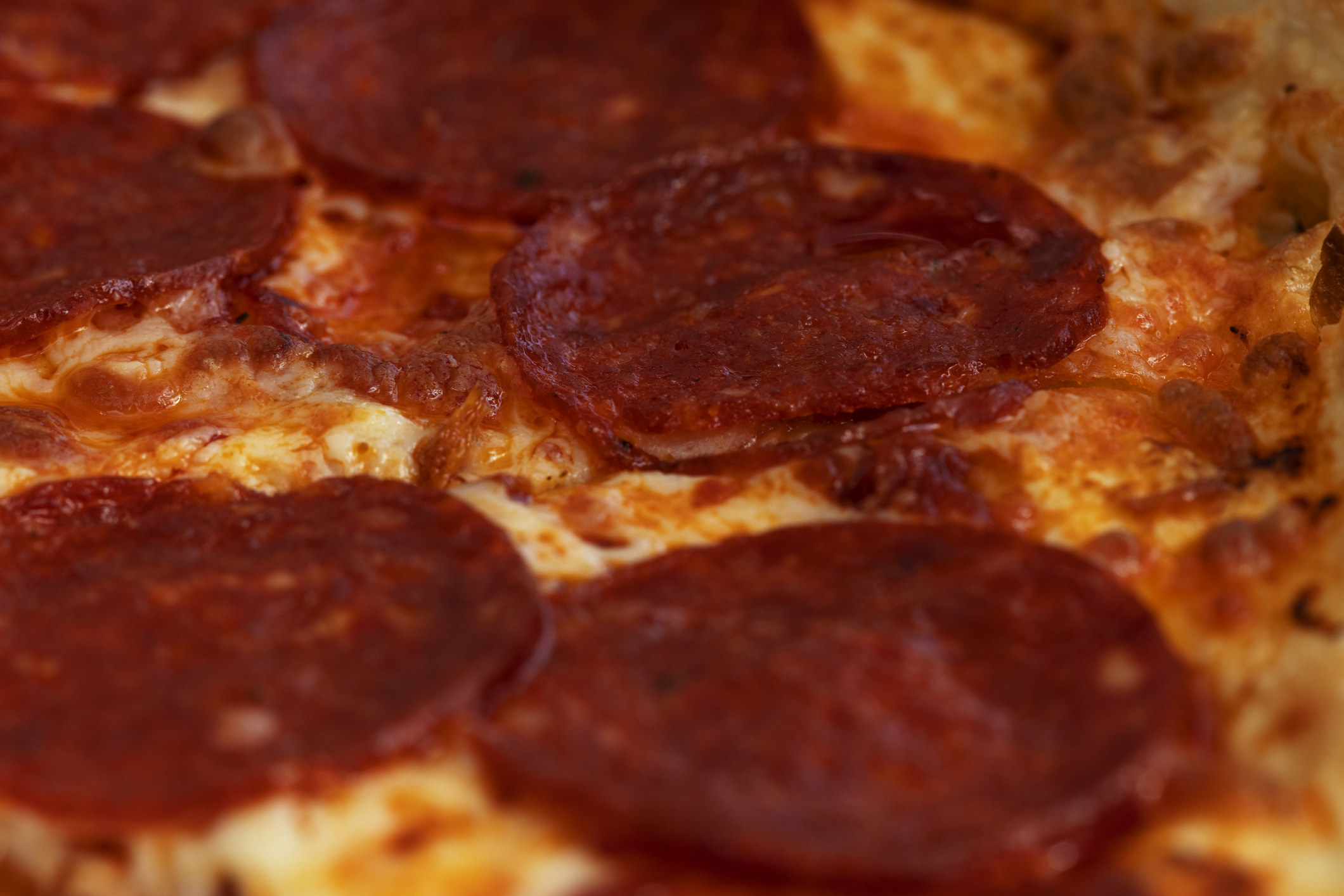 Slice of pizza with pepperoni.