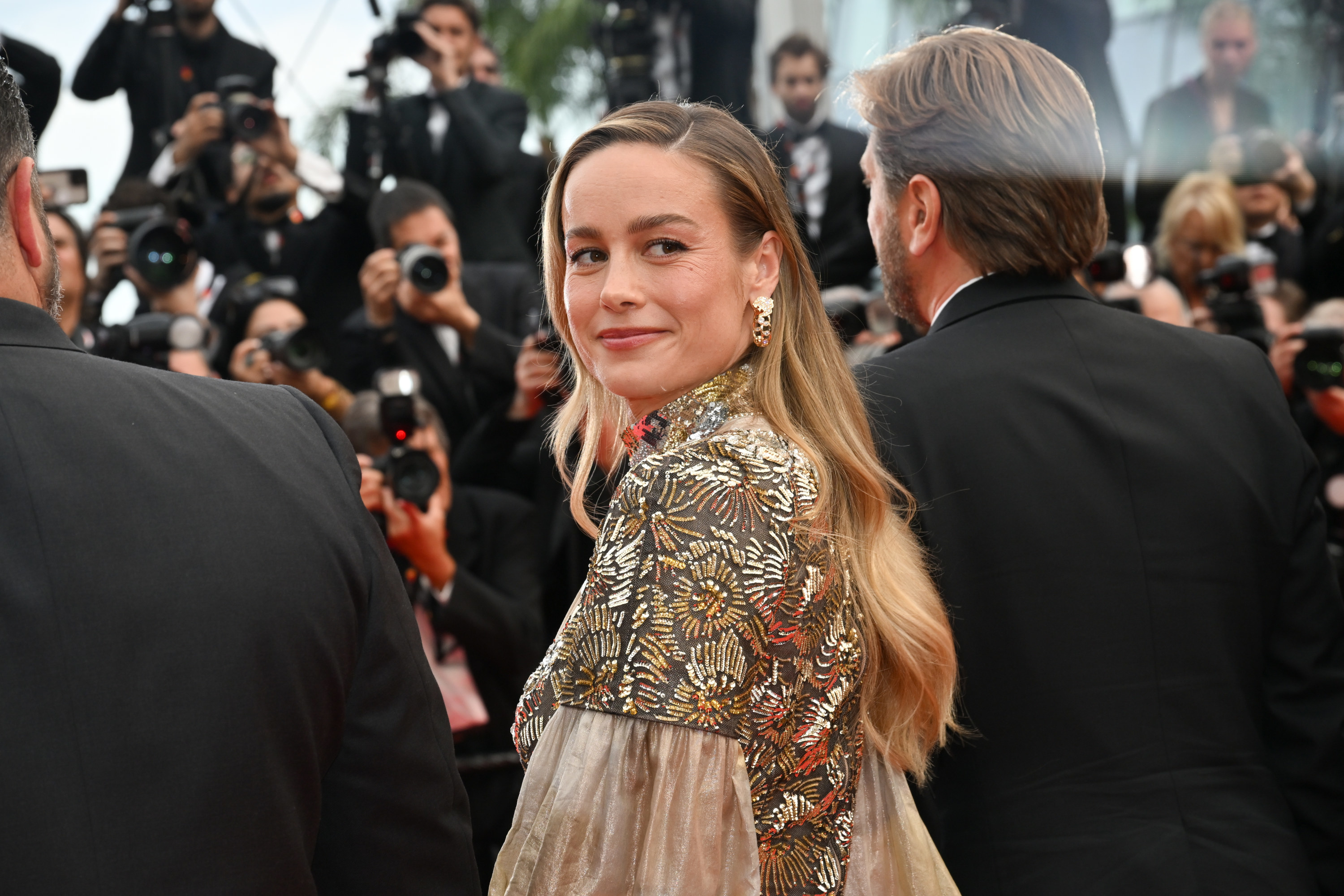 brie looking back over her shoulder at an event