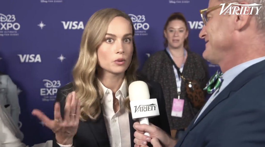brie talking to a variety reporter at the disney expo