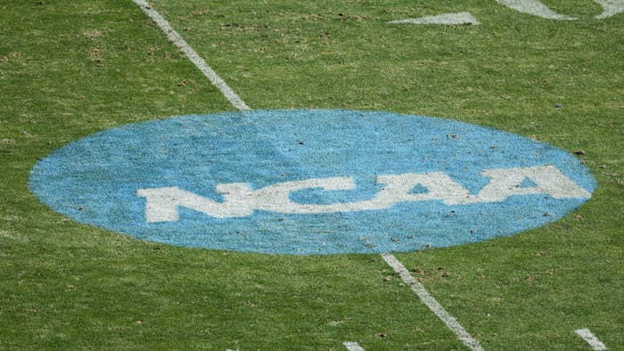 NCAA logo is seen on the field before a football game.