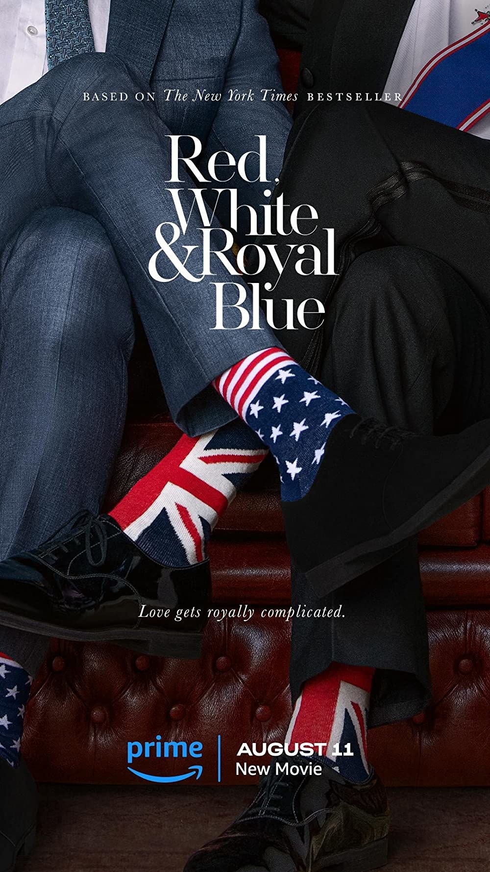 A man wearing American flag socks sits beside a man wearing socks with the British flag