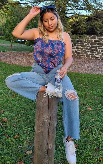 Reviewer wearing the blue and red top