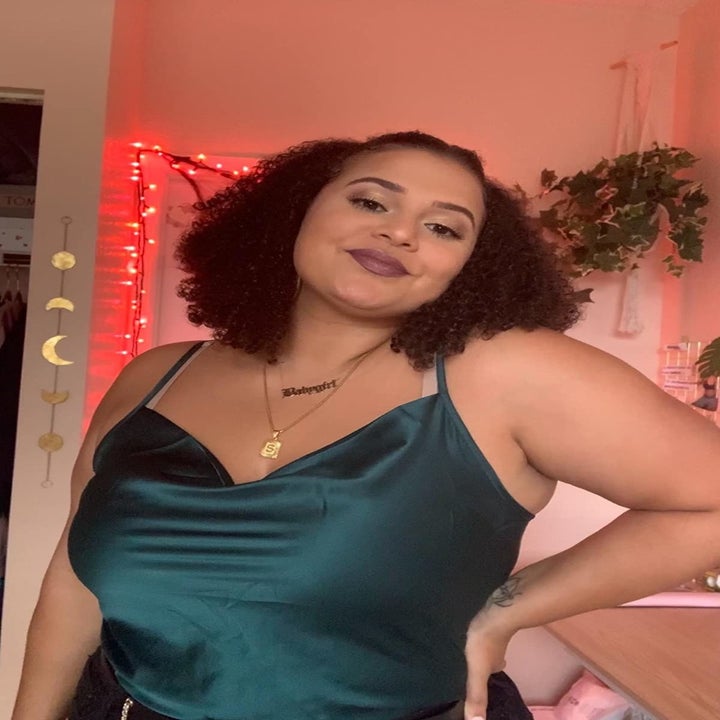 Reviewer wearing the dark green top