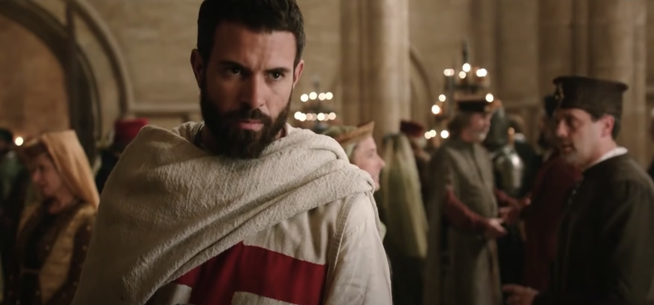 screenshot of the tv series Knightfall with a man looking past the cameras