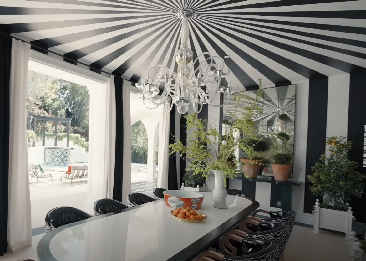 black and white stripes leading to a point over the ceiling of an outdoor dining room