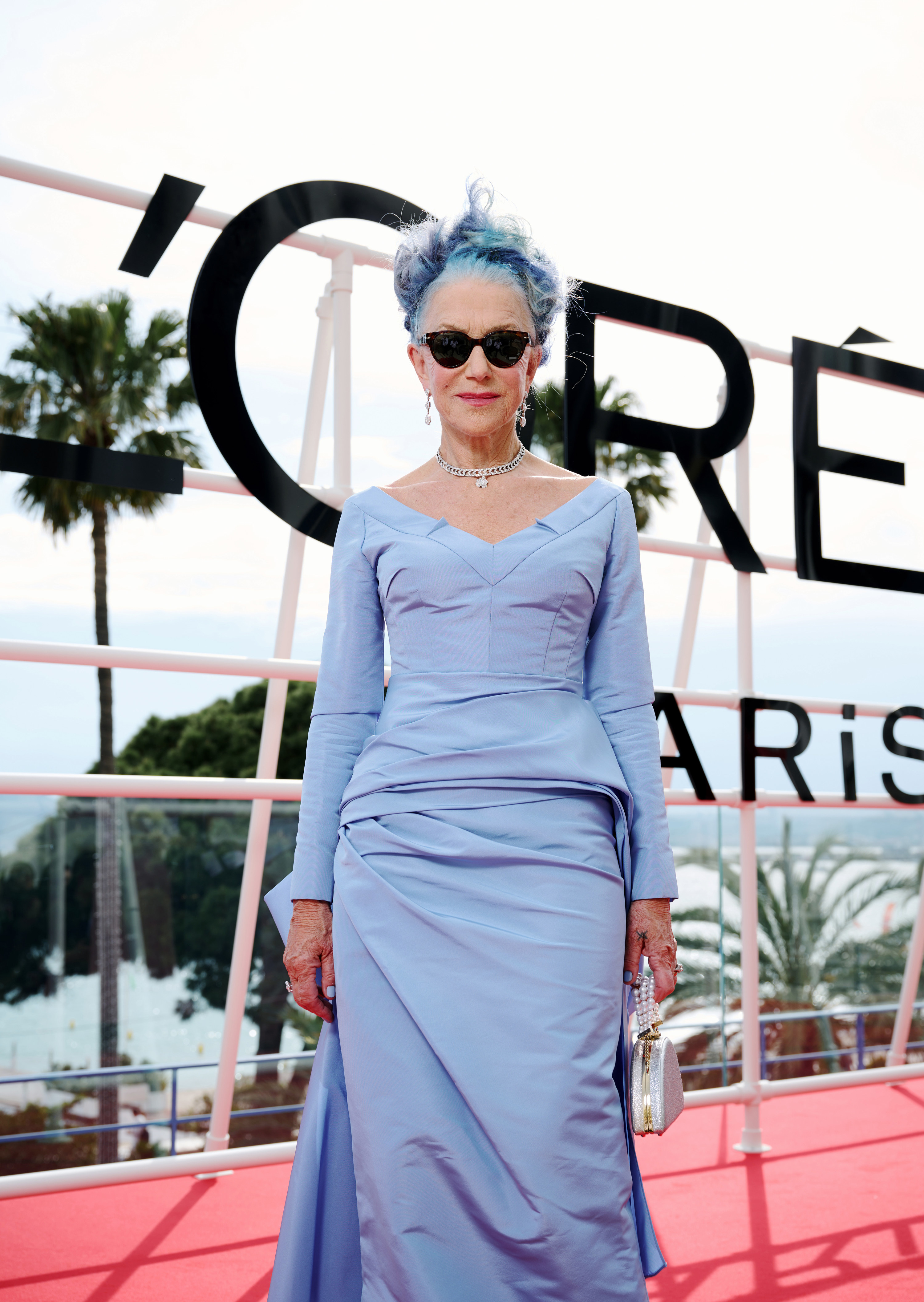 Helen poses at the event with sunglasses on