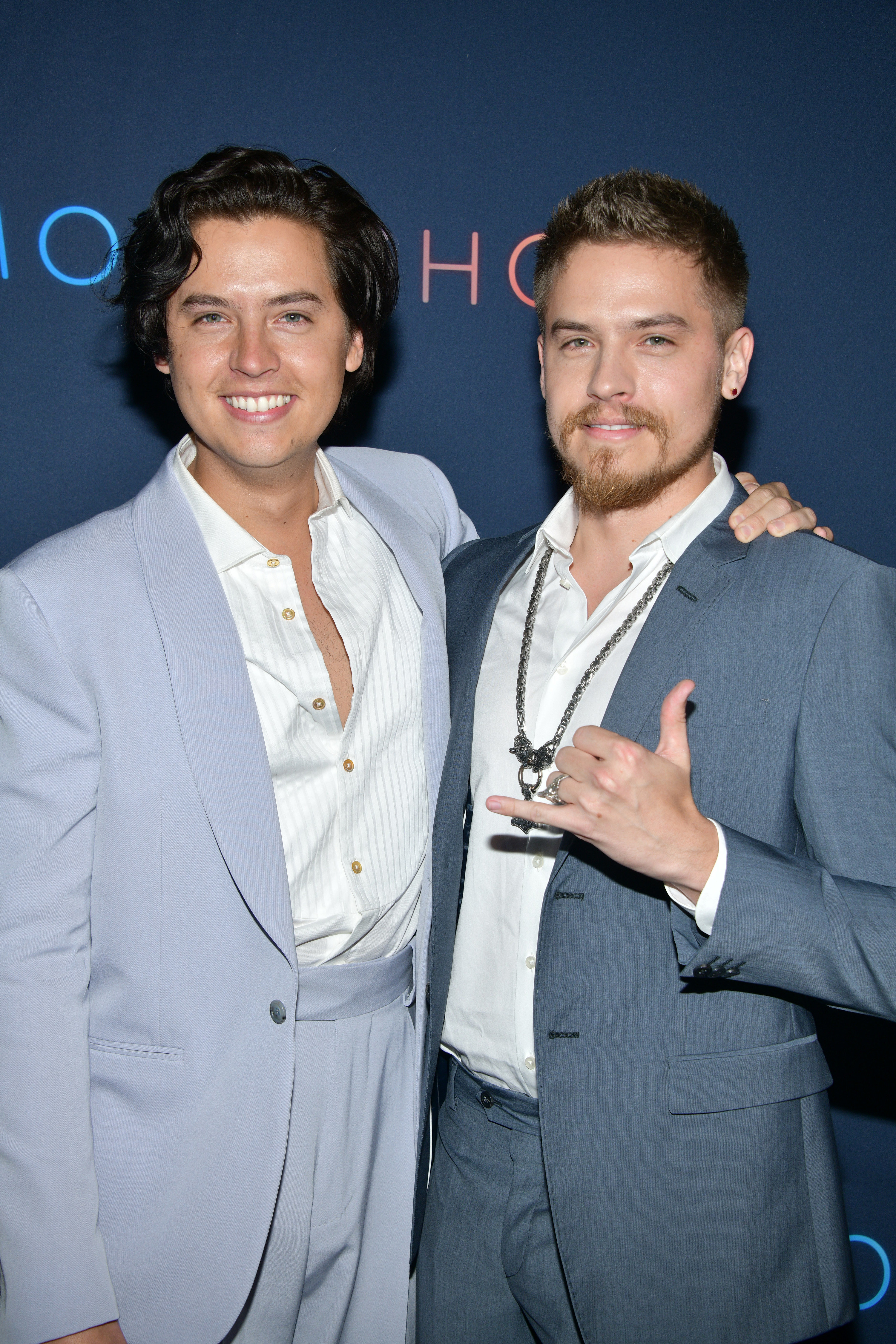 Cole Sprouse and Dylan Sprouse pose at a &quot;Moonshot&quot; screening on March 23, 2022