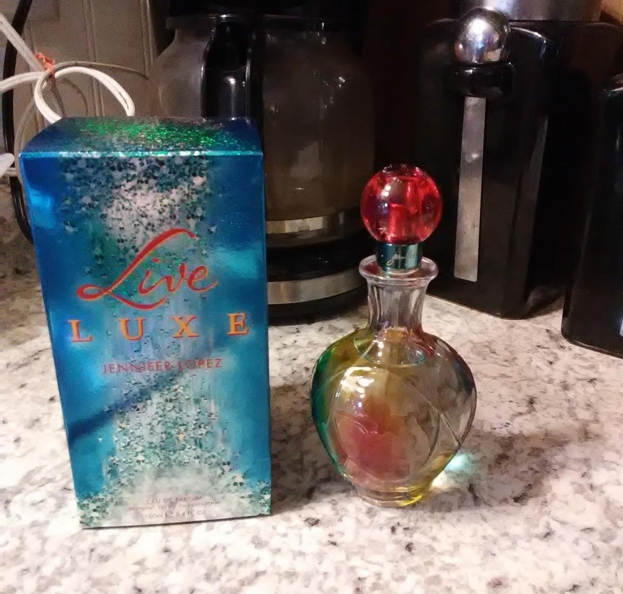 colorful bottle of the Live By Jennifer Lopez perfume on counter
