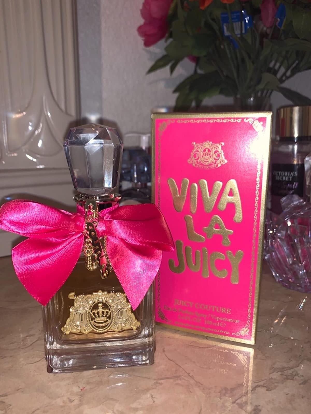 bottle of the Viva La Juicy perfume with pink bow