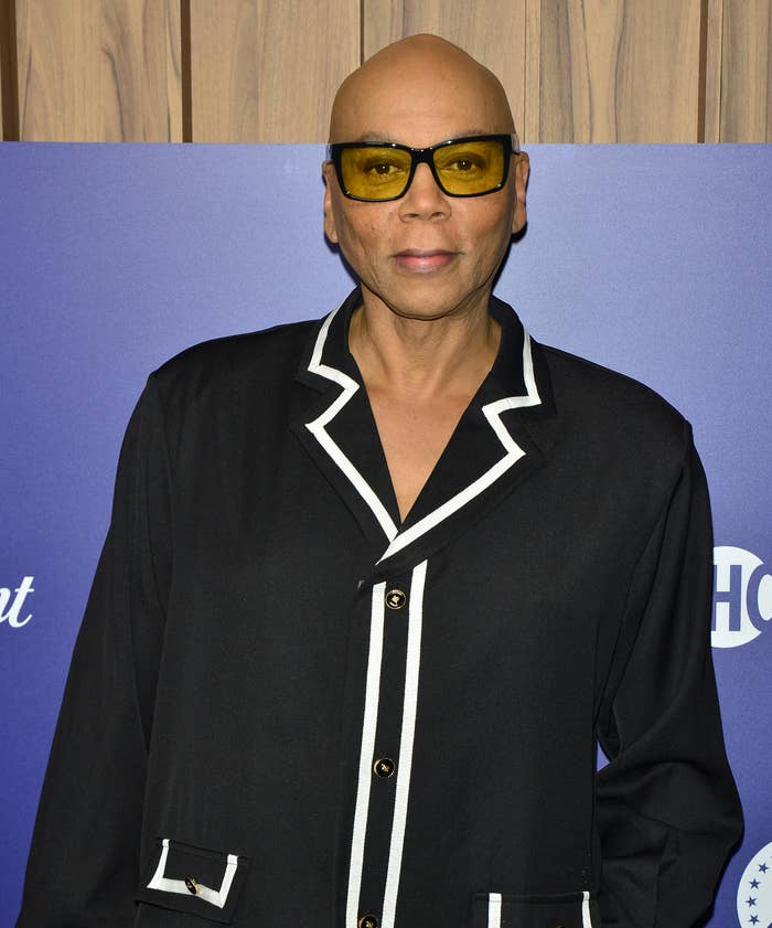 RuPaul in front of a step and repeat