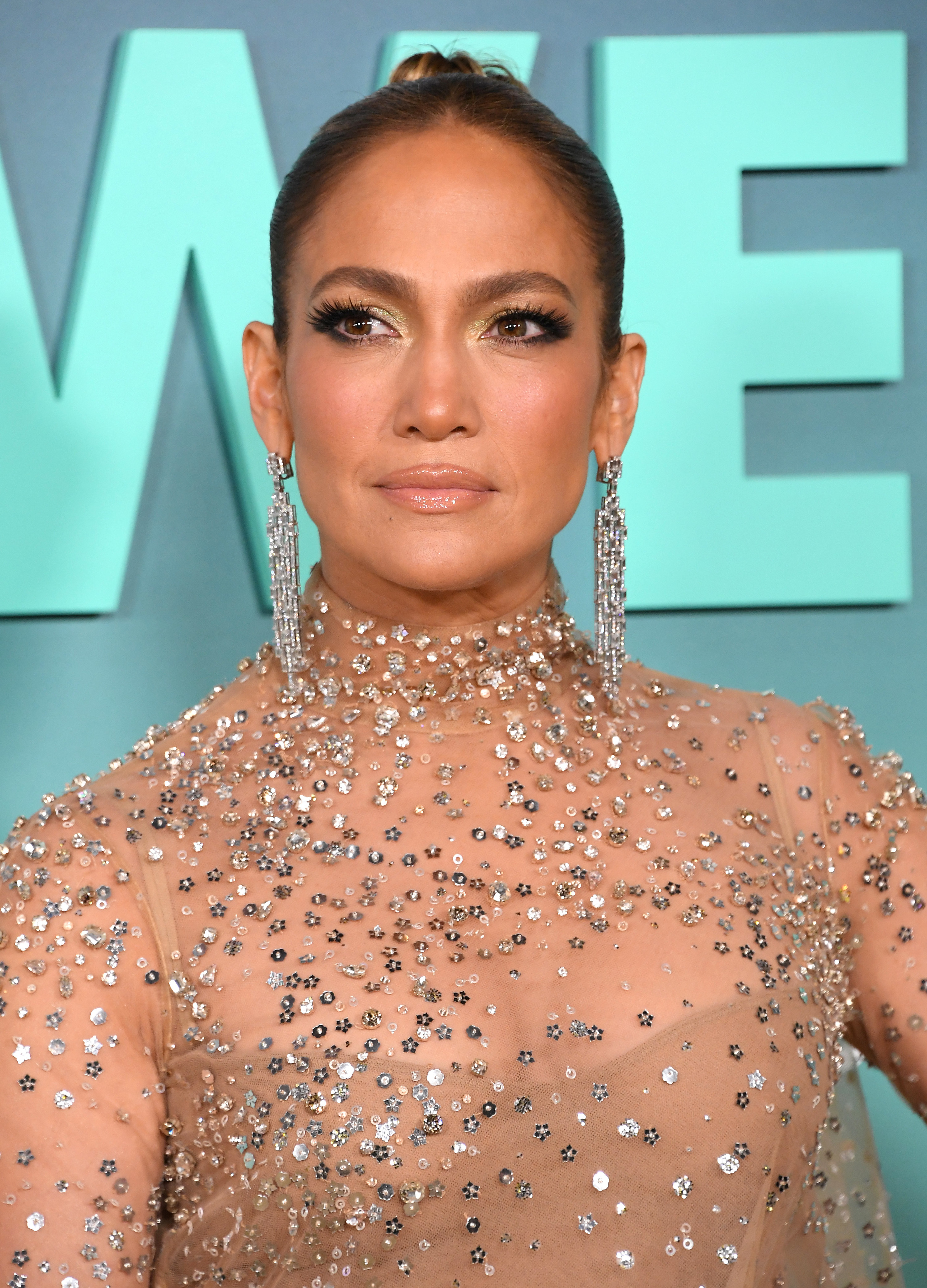 Close-up of JLo in an embellished outfit